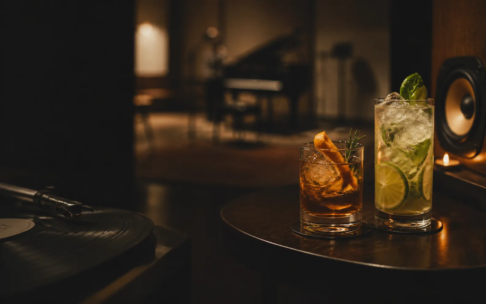 Concept preview of cocktails beside vinyl and a speaker downstairs