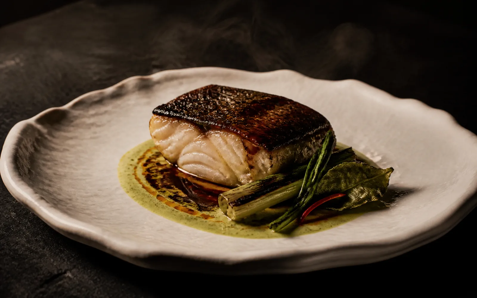 Concept preview of charcoal-roasted aged fish with a restrained Thai-Japanese sauce